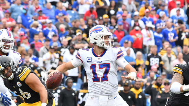 Buffalo Bills quarterback Josh Allen (17) throws a pass under pressure from Pittsburgh Steelers linebacker Alex Highsmith (56) and defensive end Tyson Alualu (94).